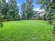 Expansive backyard featuring well-manicured lawn and privacy at 218 Inwood Forest Dr, Raleigh, NC 27603