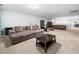 Expansive carpeted basement featuring a large sectional sofa and entertainment area, great for Gathering gatherings at 218 Inwood Forest Dr, Raleigh, NC 27603