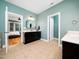 Bathroom featuring double vanity and access to bedroom and toilet room at 218 Inwood Forest Dr, Raleigh, NC 27603