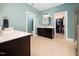 Bathroom featuring double sink vanity, walk in closet and toilet room at 218 Inwood Forest Dr, Raleigh, NC 27603