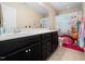 bathroom with double vanity, playful shower curtain and cheerful decor at 218 Inwood Forest Dr, Raleigh, NC 27603
