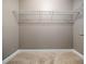 Organized walk-in closet with sturdy wire shelving and neutral tones, maximizing storage space at 218 Inwood Forest Dr, Raleigh, NC 27603