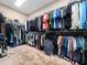 Walk-in closet with wall-to-wall shelving and hanging racks at 218 Inwood Forest Dr, Raleigh, NC 27603