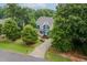 Charming home with a landscaped front yard, inviting curb appeal, and a long driveway at 218 Inwood Forest Dr, Raleigh, NC 27603