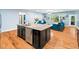 Bright kitchen with island, granite counters, stainless steel appliances and light blue walls at 218 Inwood Forest Dr, Raleigh, NC 27603
