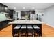Spacious kitchen with a large island, seating and stainless steel appliances at 218 Inwood Forest Dr, Raleigh, NC 27603
