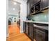 Kitchen with black cabinets, granite counter tops, stainless steel appliances and hardwood floors at 218 Inwood Forest Dr, Raleigh, NC 27603