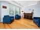 The living room features hardwood floors, ample windows, and comfortable seating at 218 Inwood Forest Dr, Raleigh, NC 27603