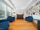 Cozy living room features a bar area, recessed ceilings, and a wall of photos at 218 Inwood Forest Dr, Raleigh, NC 27603