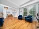 Bright open-concept layout of living room into dining room with beautiful hardwood floors at 218 Inwood Forest Dr, Raleigh, NC 27603