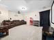 Comfortable media room with large screen, reclining chairs, and a charming vintage popcorn machine at 218 Inwood Forest Dr, Raleigh, NC 27603