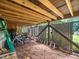 Exterior storage area under deck with room for bicycles, ladders, and yard equipment at 218 Inwood Forest Dr, Raleigh, NC 27603