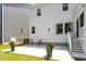Back patio with chairs and potted plants, perfect for outdoor relaxation and entertaining at 223 Chauncey Cir, Chapel Hill, NC 27516