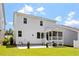 Spacious backyard with a patio, lawn, and screened-in porch perfect for outdoor living at 223 Chauncey Cir, Chapel Hill, NC 27516