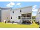 Backyard featuring a patio, lawn, and screened porch, creating an ideal space for relaxation at 223 Chauncey Cir, Chapel Hill, NC 27516