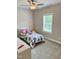 Cozy bedroom featuring a twin bed and natural light from the window at 223 Chauncey Cir, Chapel Hill, NC 27516