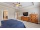 Bright bedroom with a ceiling fan, recessed lighting, and ample storage at 223 Chauncey Cir, Chapel Hill, NC 27516