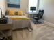Comfortable bedroom with a desk area, neutral walls, and a plush carpet, with a comfortable bed at 223 Chauncey Cir, Chapel Hill, NC 27516