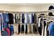 Organized walk-in closet with ample hanging space and shelving for clothing and accessories at 223 Chauncey Cir, Chapel Hill, NC 27516
