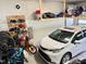 Spacious garage with car, bikes, and overhead storage racks at 223 Chauncey Cir, Chapel Hill, NC 27516