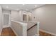 Second floor hallway with wood floors and view to bathroom at 223 Chauncey Cir, Chapel Hill, NC 27516
