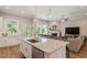 Spacious kitchen with granite island open to the living room at 223 Chauncey Cir, Chapel Hill, NC 27516
