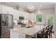 Bright kitchen with granite counters, stainless appliances, and pendant lighting at 223 Chauncey Cir, Chapel Hill, NC 27516