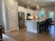 Well-lit kitchen with stainless steel appliances, granite countertops, a center island, and hardwood floors at 223 Chauncey Cir, Chapel Hill, NC 27516
