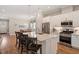 Open kitchen boasts granite countertops, an island, and stainless steel appliances at 223 Chauncey Cir, Chapel Hill, NC 27516