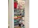Organized linen closet with shelves stocked with towels, linens, and toiletries at 223 Chauncey Cir, Chapel Hill, NC 27516