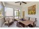Relaxing screened porch with comfortable seating and a table for outdoor dining at 223 Chauncey Cir, Chapel Hill, NC 27516