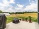 Backyard view from patio showing landscaping and open space at 2413 Whelen Dr, Graham, NC 27253