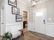 Bright entryway featuring a bench, stylish decor, and a view into the mudroom at 2413 Whelen Dr, Graham, NC 27253