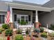 Charming front porch with rocking chairs, decorative plants, and a welcoming atmosphere at 2413 Whelen Dr, Graham, NC 27253