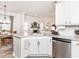 Kitchen featuring white cabinetry, granite countertops, and view of dining and living areas at 2413 Whelen Dr, Graham, NC 27253