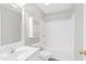 Clean bathroom featuring a shower-tub combo, vanity, toilet and storage shelves at 2419 Pepperstone Dr, Graham, NC 27253