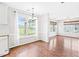 Bright dining area featuring natural light and hardwood floors, with a view of the backyard at 2419 Pepperstone Dr, Graham, NC 27253