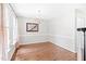 Open dining room with hardwood floors and chandelier, perfect for Gathering meals at 2419 Pepperstone Dr, Graham, NC 27253