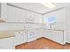 Updated kitchen with white cabinets, granite countertops, and modern appliances at 2419 Pepperstone Dr, Graham, NC 27253