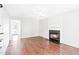 Hardwood floors, bright walls, and a cozy fireplace define this welcoming living space at 2419 Pepperstone Dr, Graham, NC 27253