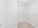 Spacious walk-in closet featuring wall-mounted metal shelving for optimal organization and storage at 2419 Pepperstone Dr, Graham, NC 27253