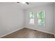 This bedroom has hardwood floors and a ceiling fan at 2474 Sumter Dr, Garner, NC 27529