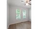 This bedroom has hardwood floors and a ceiling fan at 2474 Sumter Dr, Garner, NC 27529