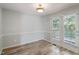 Bright dining area features wood-look floors, crown molding and direct access to an outdoor deck at 2474 Sumter Dr, Garner, NC 27529