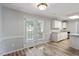 Bright dining area features wood-look floors and leads to the kitchen with white cabinets at 2474 Sumter Dr, Garner, NC 27529
