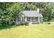 Charming one-story home with a well-maintained lawn and mature trees at 2474 Sumter Dr, Garner, NC 27529