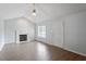 Cozy living room with fireplace, natural light, and access to other rooms at 2474 Sumter Dr, Garner, NC 27529