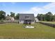Spacious backyard with a fire pit and lawn at 31 Sweet Birch Ave, Zebulon, NC 27597