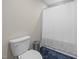 Bathroom features a toilet, and a shower with a curtain at 31 Sweet Birch Ave, Zebulon, NC 27597