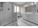 Elegant bathroom with walk-in glass shower and dual sink vanity with modern lighting at 31 Sweet Birch Ave, Zebulon, NC 27597